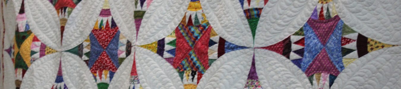 photo of a quilt with colorful squares